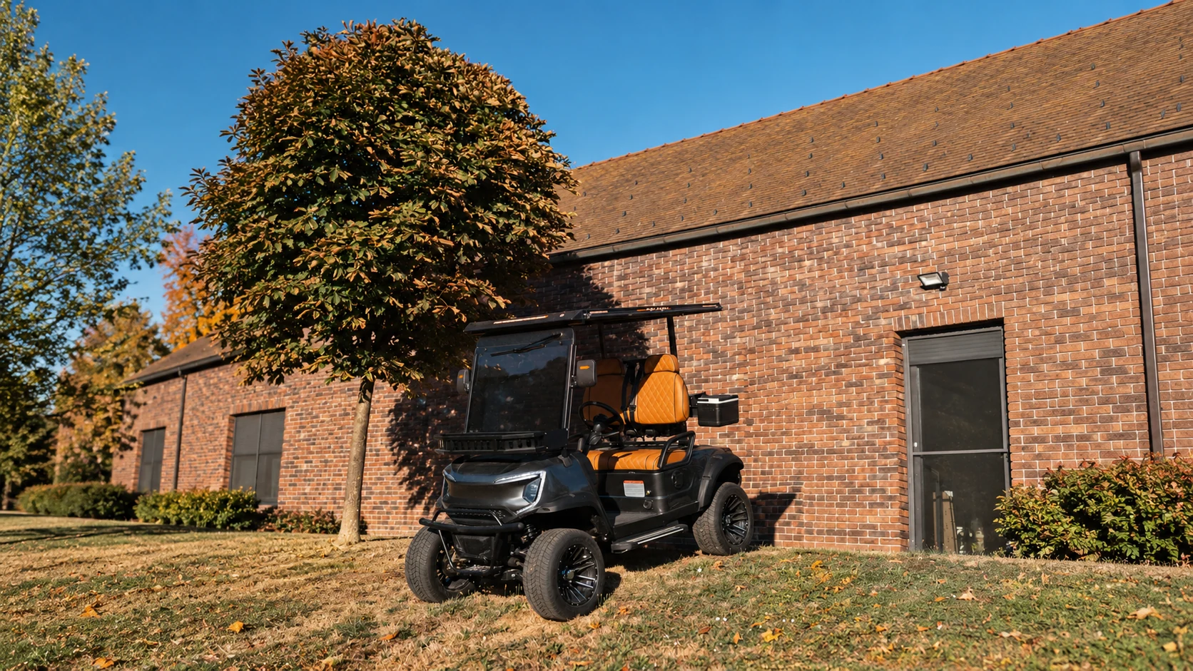 Golf Shuttle Elite 2 beside a stone building